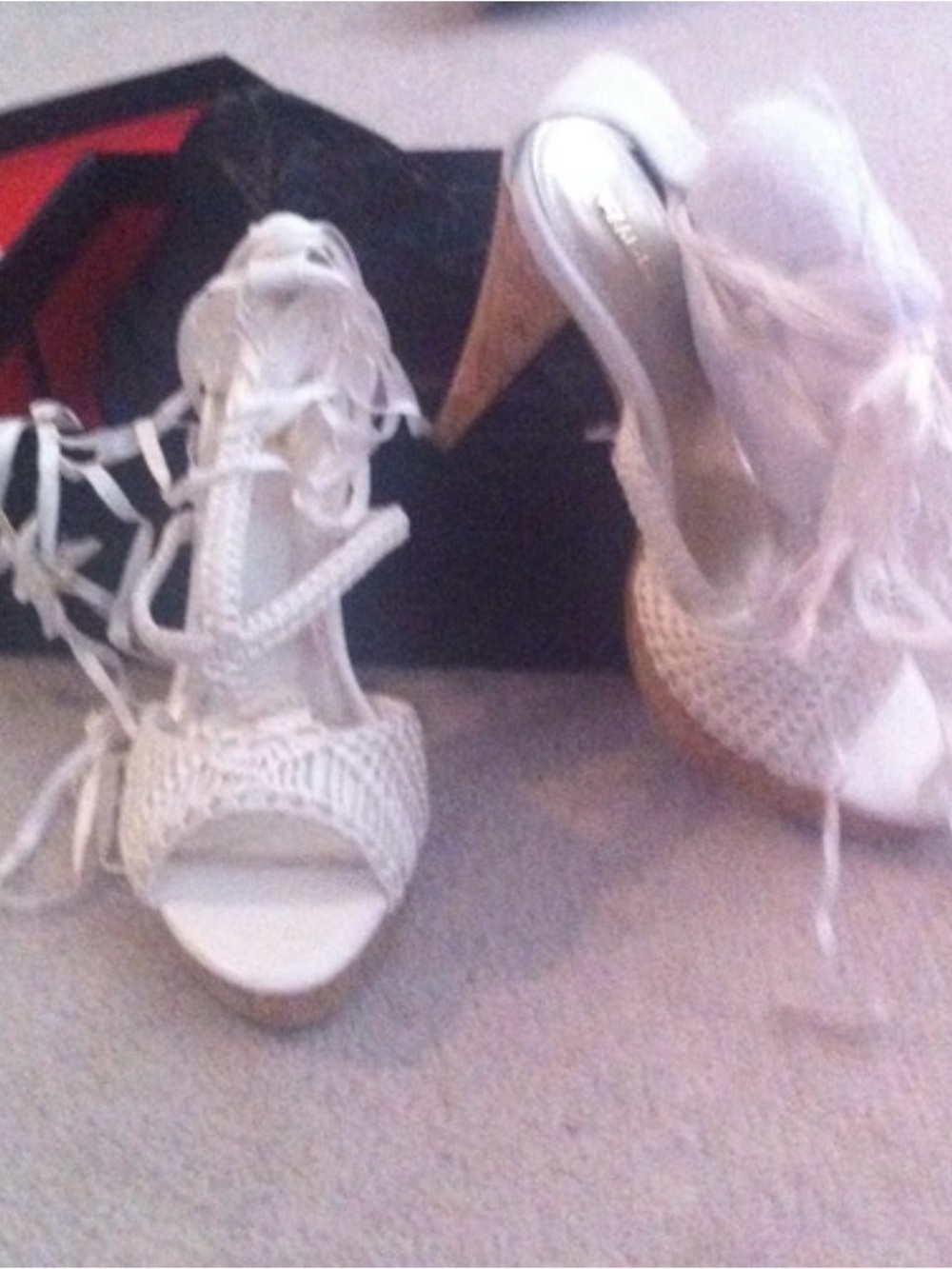 woven net sandals feature a distinct cork wedge heel and lace-up ankle ties